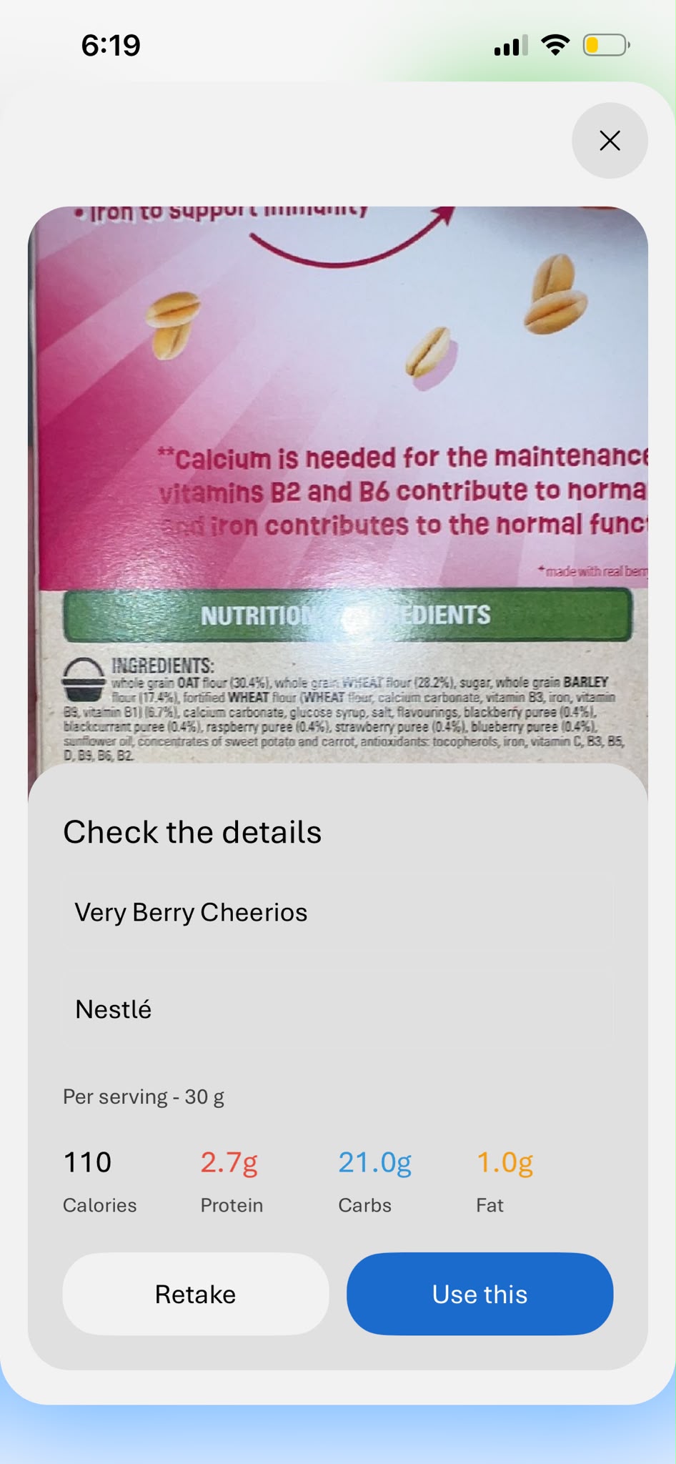 Label scan result showing the product name, brand and per-serving calories, protein, carbs and fat read from a photo.
